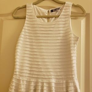 Jennifer Lopez JL white blouse.